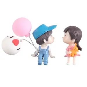 Cute cartoon couple ornament for car dashboard and desktop, sweet resin figurine with balloons.