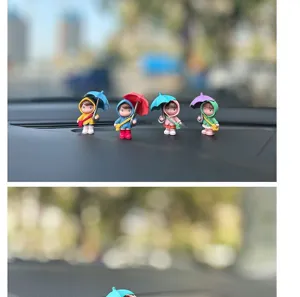 Cute cartoon umbrella girl car dashboard ornament, healing character toy figure details.