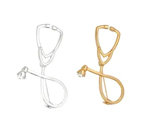 Stethoscope design metal brooch detail view, doctor nurse medical theme jewelry accessory.