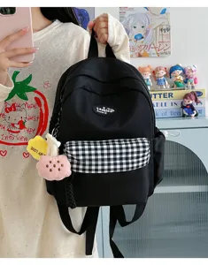 Casual black canvas backpack with plaid front pocket, cute stylish daily daypack for women.