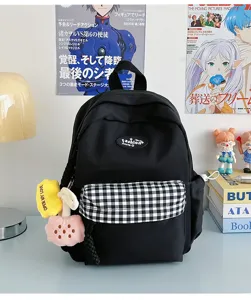 Black casual backpack with plaid front pocket, cute plush charm, perfect for daily use.