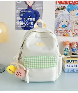 Cute white canvas backpack with green plaid pocket and plush charms, casual daily mini bag