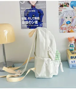 Mini canvas backpack for women, cute school bag with plaid pocket and braided straps.
