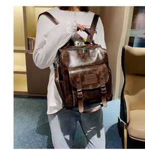 Vintage PU leather women backpack, solid color large capacity casual daypack with multiple straps.