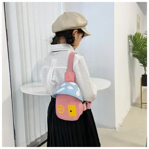 Cute mushroom design children sling bag detail, featuring lovely cartoon house shape and vibrant colors.