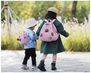 Cute mini corduroy backpack with lovely animal ears design, kids outdoor lifestyle scene display.
