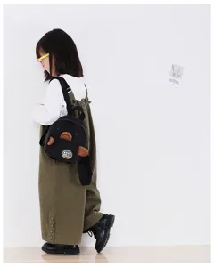 Cute mini corduroy backpack detail shot featuring playful animal ears and front patch design.