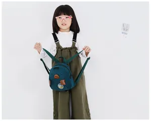 Mini casual corduroy backpack for kids, cute cartoon animal design, green mini school bag.