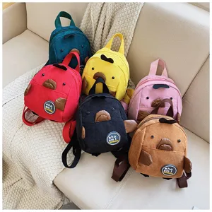 Cute mini corduroy backpack with quirky cartoon animal design, casual student daypack for daily wear.