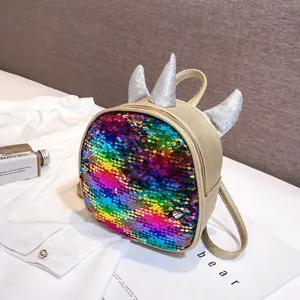 Details of the colorful sequin unicorn mini backpack with sparkly horns, kids fashion accessory.