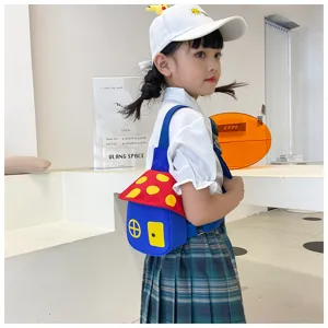 Children mushroom chest bag scene detail view, cute blue and red cartoon shoulder bag for kids.