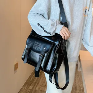 Black PU leather vintage women backpack, casual school satchel bag with double buckle straps.
