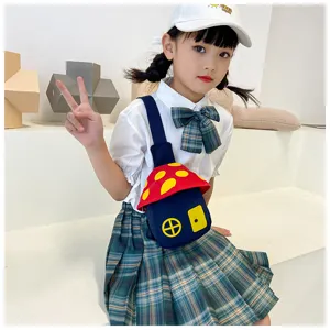 Mushroom shaped kids crossbody chest bag detail, cute cartoon design with vibrant red and blue colors.