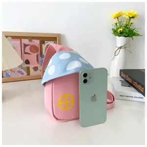Detailed closeup of cute mushroom shaped children chest bag featuring pink and blue design.
