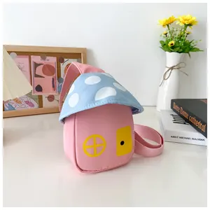 Cute mushroom house children chest bag detail view, pink and blue crossbody purse.