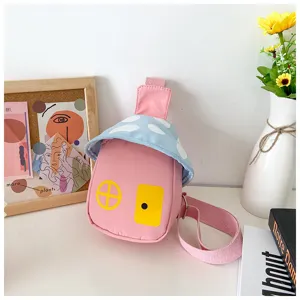 Kids cute mushroom shaped crossbody bag detail view showing pink and blue design and door print.
