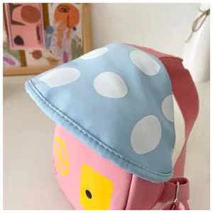 Cute children crossbody chest bag with cute mushroom house design, pink and blue polka dot.
