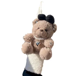 Cute brown plush teddy bear car seatbelt shoulder pad with black bow and pearl heart necklace.