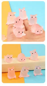 Cute mini pink translucent pig figurine set, perfect for car dashboard and desk decor.