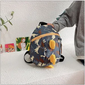 Kids dinosaur backpack detail, cute cartoon toddler school bag with 3D spikes and soft straps.