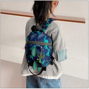 Detailed view of cute dinosaur toddler backpack featuring 3d dorsal fins and fun print.