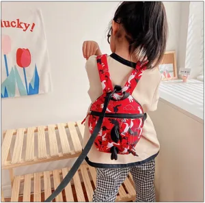 Toddler anti-lost dinosaur backpack cute red school bag for kids boys and girls daily use.