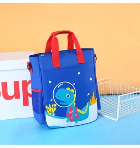 Kids cartoon canvas tote bag with dinosaur pattern, blue shoulder school bag for daily use.