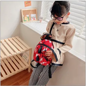 Cute kids dinosaur backpack for toddler boys and girls, lightweight waterproof school bag.