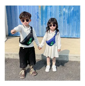 Outdoor scene detail showing kids wearing cute cartoon dinosaur crossbody waist bags.