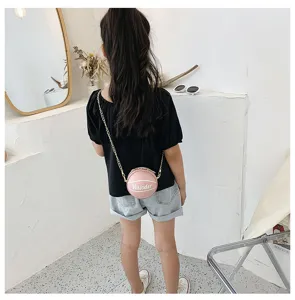 Children pink basketball shaped crossbody bag detail view, cute PU leather chain shoulder purse.