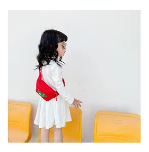Cute kids red waist bag with dinosaur cartoon print, perfect casual crossbody bag for stylish children.