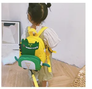 Cute cartoon dinosaur children backpack with anti-lost leash, perfect for kindergarten boys.