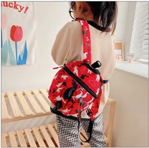 Cute kids dinosaur print backpack, lightweight toddler school bag for boys and girls daily use.