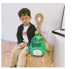 Cute green dinosaur backpack for kids, stylish and fun cartoon kindergarten school bag details