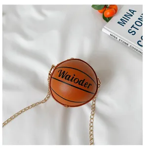 Basketball shaped crossbody bag detail view with chain strap and stylish design elements.
