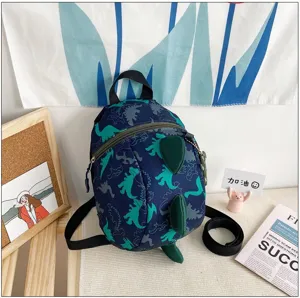 Detailed view of kids cartoon dinosaur backpack with cute 3D green spines and straps.