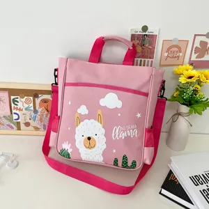 Cute pink canvas crossbody tote bag for kids with adorable cartoon llama print and shoulder strap.