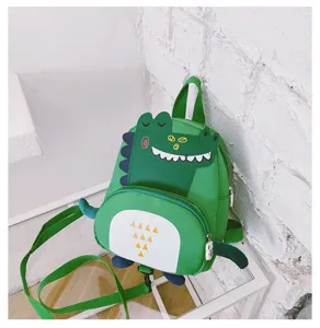 Green dinosaur children backpack detail, cute cartoon toddler school bag with straps.