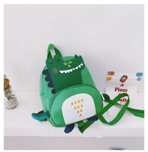 Detail shot showing the cute green dinosaur backpack, cartoon school bag for kids.
