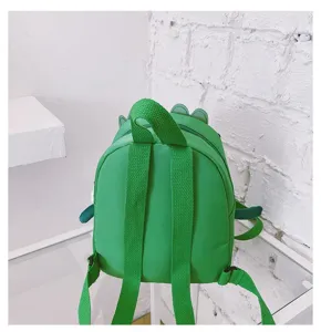 Green dinosaur kids backpack detail view showing adjustable straps and cute back design.