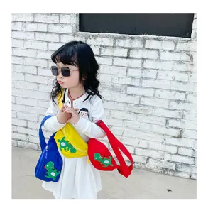 Children cartoon dinosaur chest bag detail view, colorful casual single shoulder messenger bag.