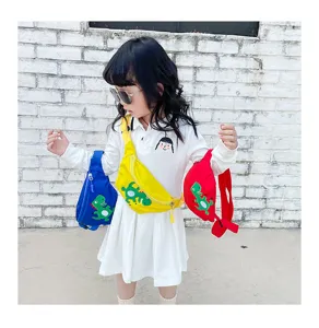 Detail shot of cute kids dinosaur crossbody waist bag in bright colors for daily casual wear.
