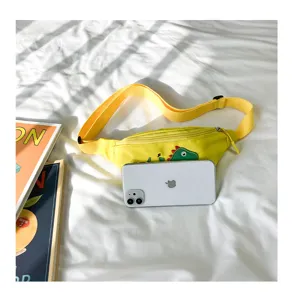 Kids yellow dinosaur waist bag detail view, cute cartoon fanny pack and casual crossbody bag.