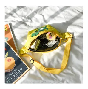 Cute yellow children cartoon dinosaur fanny pack detail shot showing spacious interior and cute design.