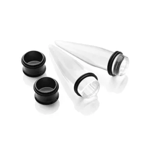 Clear acrylic ear stretching tapers and black plugs kit for body piercing modification detail view.