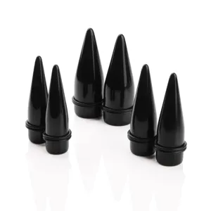 Black acrylic ear stretching tapers detail view, smooth glossy finish for body piercing.