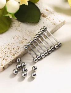 Stainless steel barbell body piercing jewelry detail showing straight bars and replacement balls.