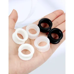Detail view of silicone ear tunnels plugs stretching kit, flexible soft body piercing gauges.
