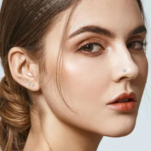 Stainless steel crystal nose stud and earring set for women body piercing jewelry details.