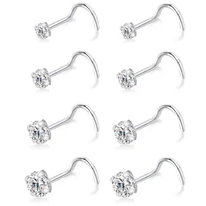 Detailed view of surgical steel crystal nose studs, sparkling cubic zirconia detail.